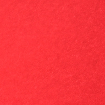 punainen pinta, jossa on valkoisia täpliä