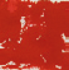 punainen maalitahra valkoisella pinnalla.